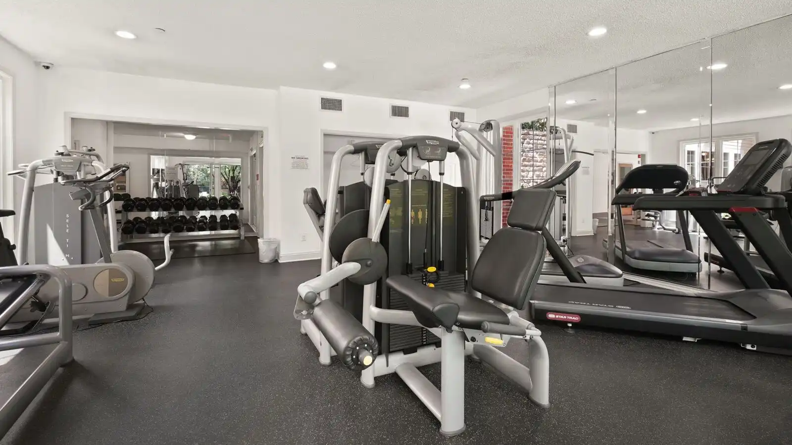 Commercial gym floor with cardio and strength equipment laid out for a fit-out budget