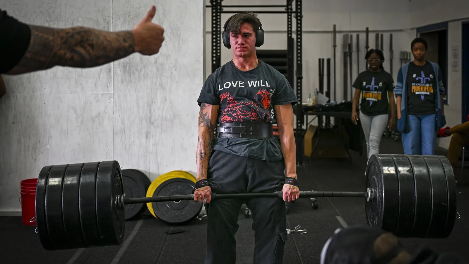 Powerlifter performing a deadlift on a gym platform
